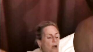 A black man has sex with a mature woman with big tits