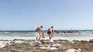 Blonde girl in group sex on the beach