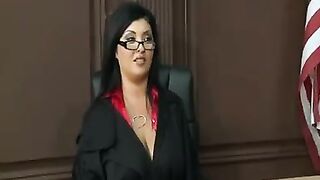 A mature woman in a police uniform demonstrates her huge boobs