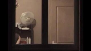A hot guy admires himself naked in the mirror