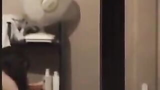 A hot guy admires himself naked in the mirror