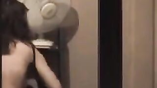 A hot guy admires himself naked in the mirror