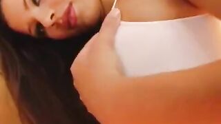 The girl plays with her pussy using a dildo and masturbates it