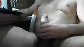 Man masturbates his dick with his hand in front of the computer