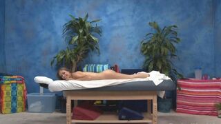A young masseuse gives an erotic massage to her client