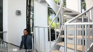 A masseuse has two male clients at her house for a massage session