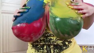 The artist is fucking with her paint while painting a picture