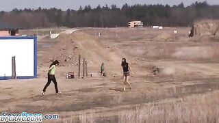 Two girls are having fun on the street without any clothes