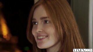 The guy carefully licked the red hair of his girlfriend on the bed