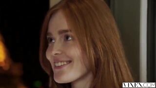 The guy carefully licked the red hair of his girlfriend on the bed
