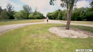 A girl is having fun with her boyfriend at the park