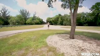 A girl is having fun with her boyfriend at the park