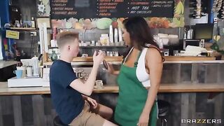 The girl with big tits is working as a barista