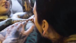 A sexy lesbian is having fun with her girlfriend using a strap-on