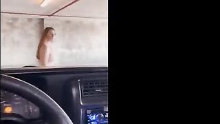A girl is fucking with a guy in the garage, who notices them
