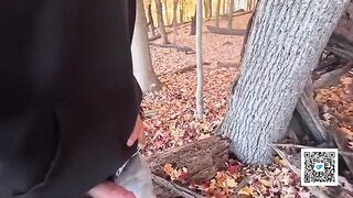 A couple enjoys a romantic walk and outdoor intimacy in the park