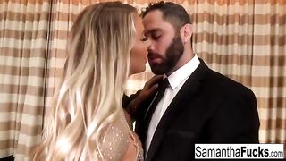A gorgeous busty blonde is having fun in a hotel room with someone