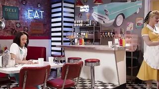 A girl is working as a waitress in an unusual job