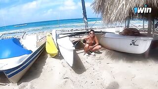 A couple enjoys passionate sex on a nude beach