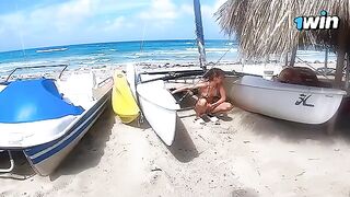 A couple enjoys passionate sex on a nude beach