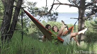 A lesbian beauty gets a tan in nature