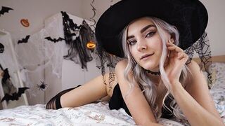 A cute witch in a pink dress waits for the magic of sex