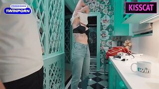 A beautiful girl is serving a young guy in a sexy maid outfit
