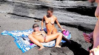 A girl stripped on the beach and caressed herself, while a guy played with his penis