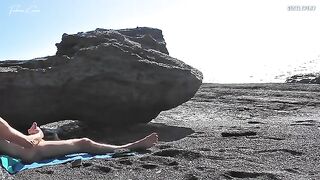 A girl stripped on the beach and caressed herself, while a guy played with his penis