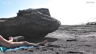 A girl stripped on the beach and caressed herself, while a guy played with his penis