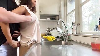 A hot brunette MILF with huge tits gets fucked in the kitchen