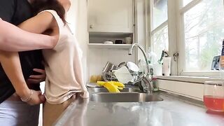 A hot brunette MILF with huge tits gets fucked in the kitchen