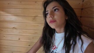 A sexy brunette gets undressed and has sex in sauna