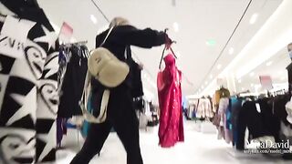 The sexy girl was almost caught while giving a blowjob in the fitting room